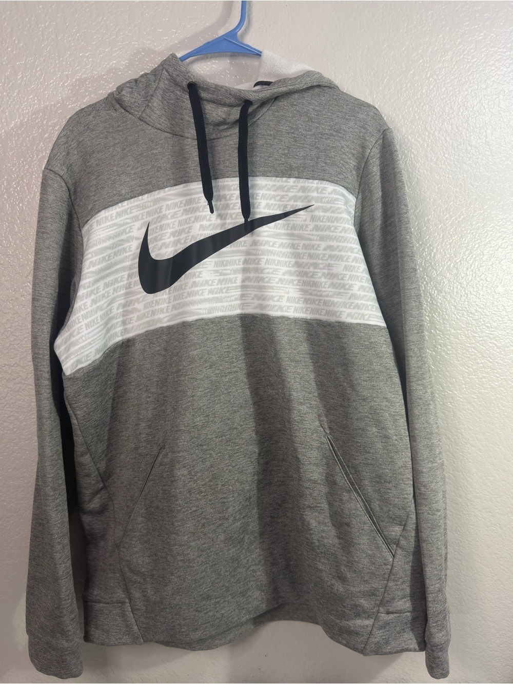 Nike Grey Pullover Hoodie with White Chest Stripe and Black Swoosh